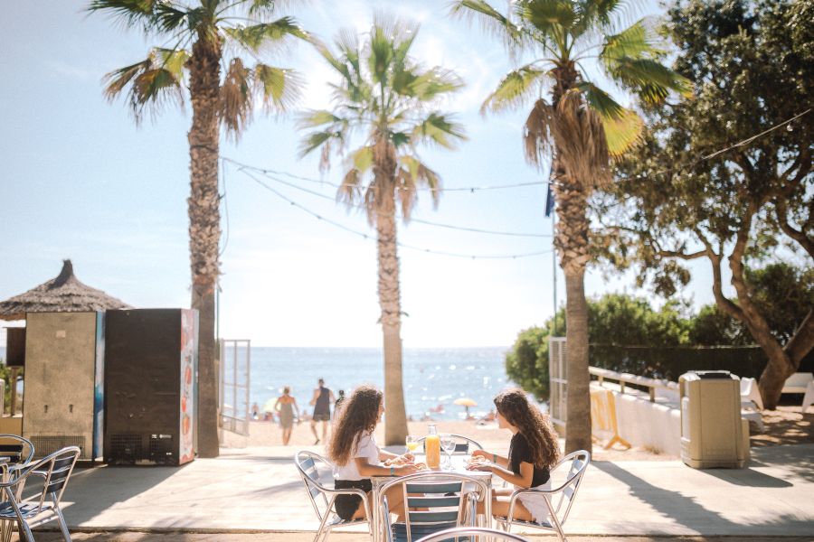 Bar on the beach. Reading a book