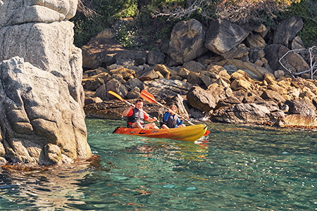 With the Kayak on the beach in front of the campsite