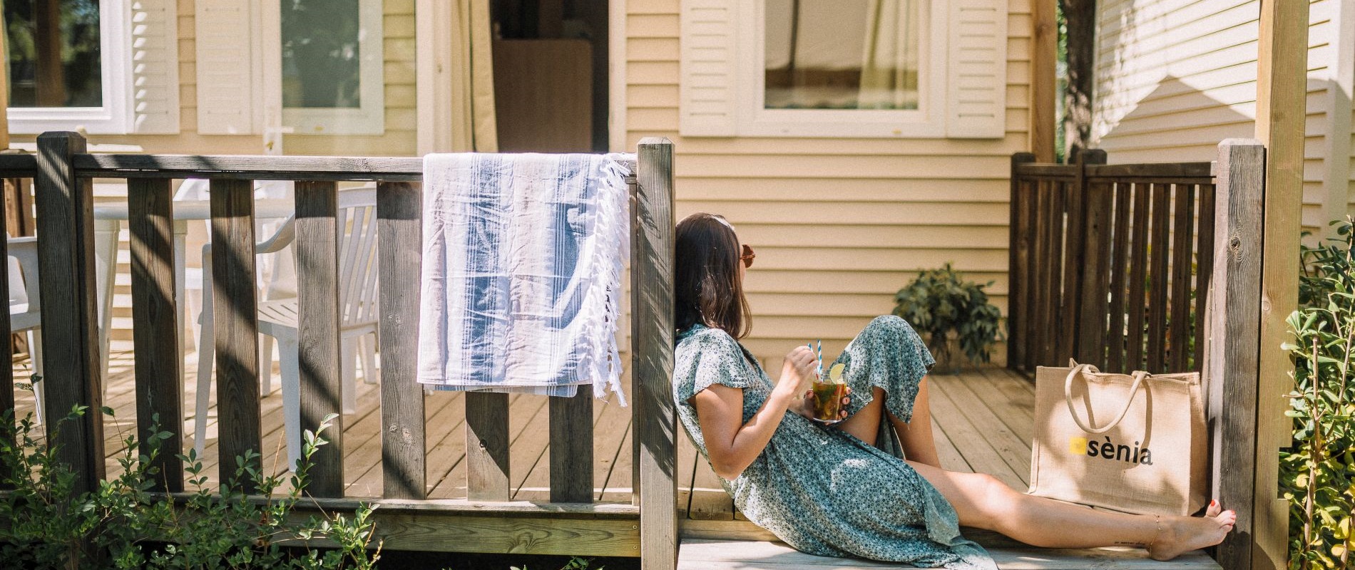 Girl resting on the terrace of the mobile home